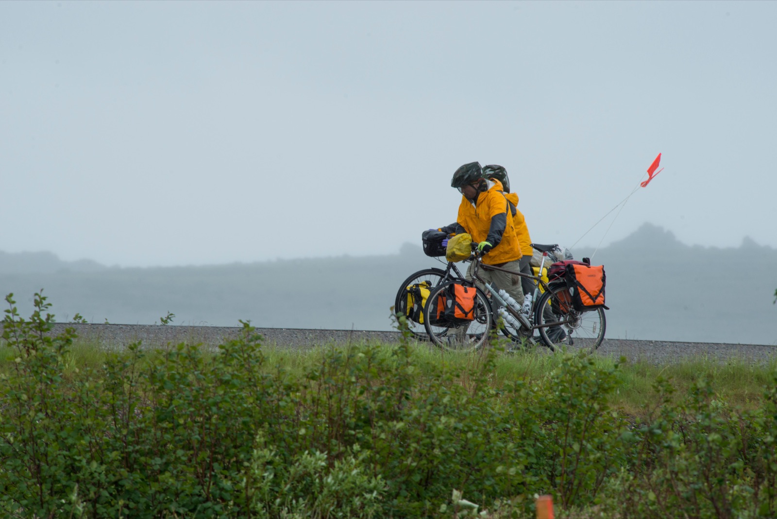 Alexander Titus cycling a mountain road on the 2 Wheels, 2 Continents expedition