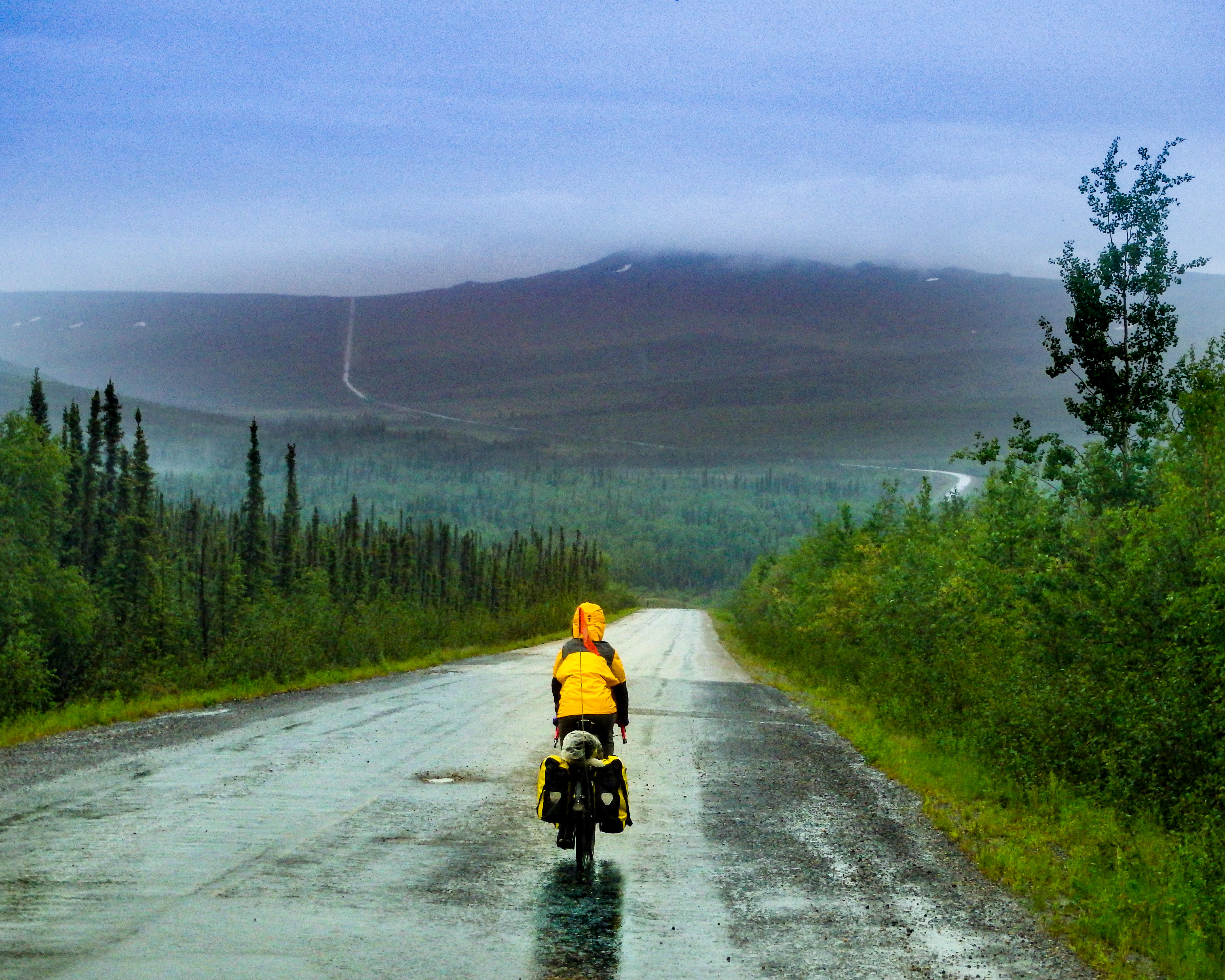 Cyclist on remote Alaskan road during the 2014 journey from Prudhoe Bay to San Francisco